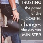 a hand holding a bible and leaning against a brick wall with text "how trusting the power of the Gospel changes the way you minister" by Graceful Abandon