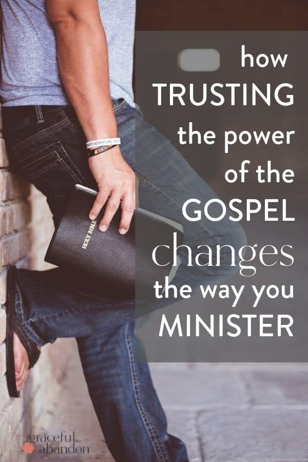 a hand holding a bible and leaning against a brick wall with text "how trusting the power of the Gospel changes the way you minister" by Graceful Abandon