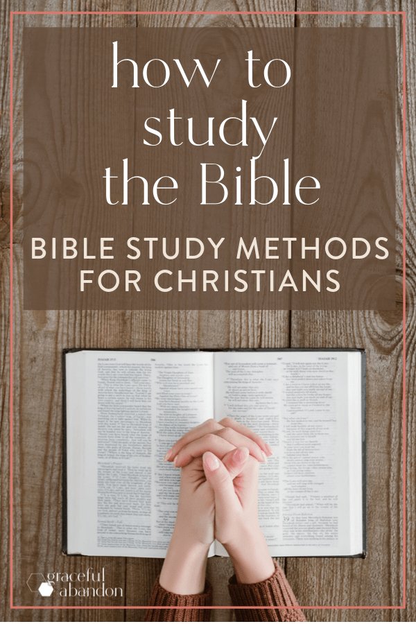 Bible with praying hands on a wooden table with text overlay "how to study the Bible: bible study methods for Christians"